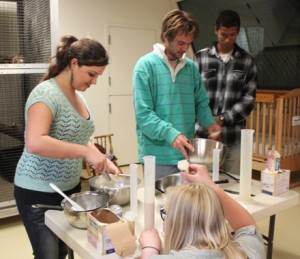 Making formula is much like mixing cake batter. Here interns Victoria and Cam whisk and strain the formula to obtain a smooth consistency. This is crucial because if the formula remains clumpy, it could cause the baby mammal to aspirate.