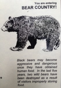 A sign in the Olympic Peninsula of Washington reminds people hiking and camping in the forest that their behavior can have negative consequences for bears.