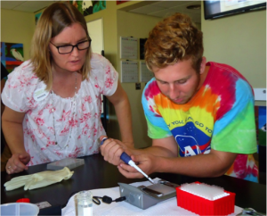 Mrs. Reinbold demonstrates how we would insert our DNA samples into the e-gel pad. It was important that we accurately measure out the DNA so that the chromosomes would be in proportion and be able to find their way to the positively charged end of the pad. If the chromosomes took longer to reach the end, that meant the chromosomes were bigger, and vice versa. The size in chromosomes helped to determine the gender of our condor.
